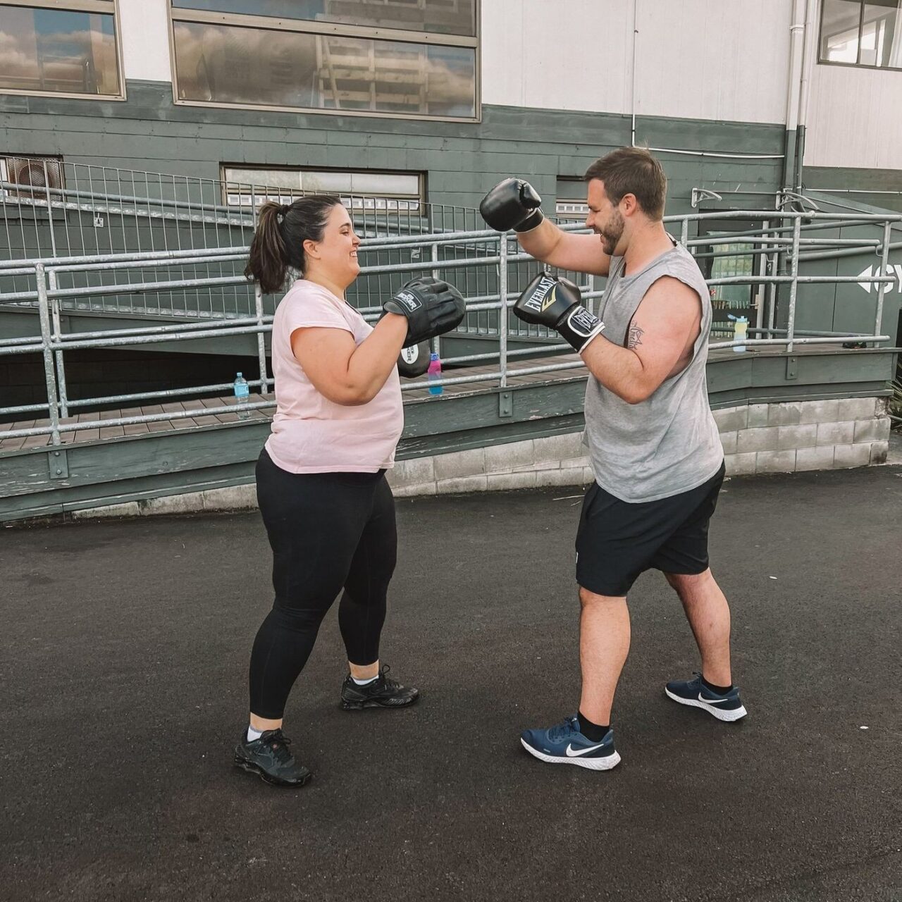 Home Sweat Home - boxing pad work during an outdoor training session in Hastings